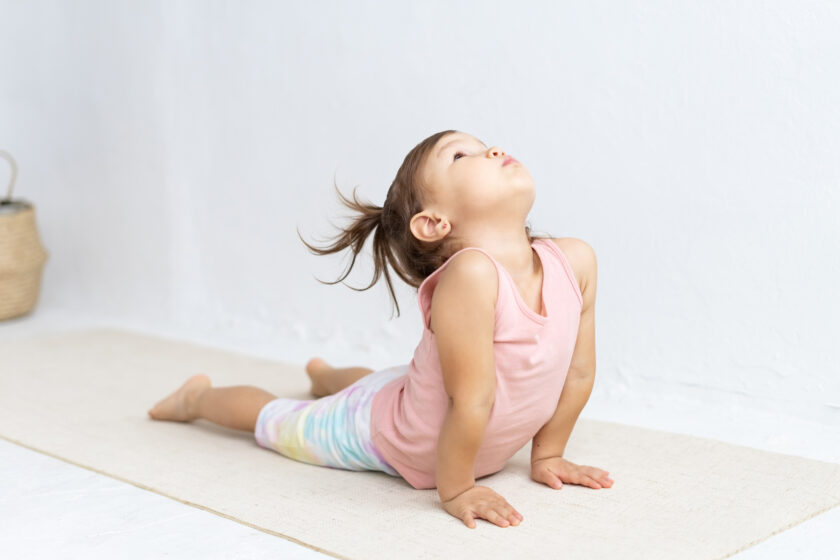 little girl doing yoga.